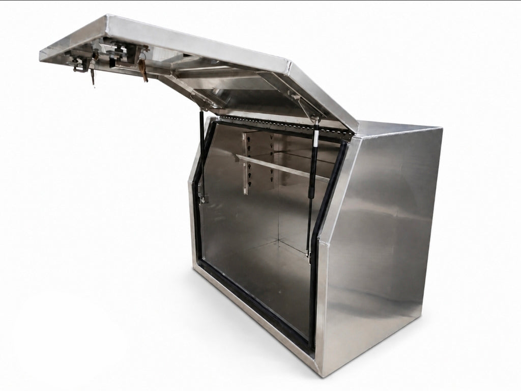 An aluminium toolbox for ute storage cabinet with its hinged lid open, showing an interior shelving, photographed on a white background.