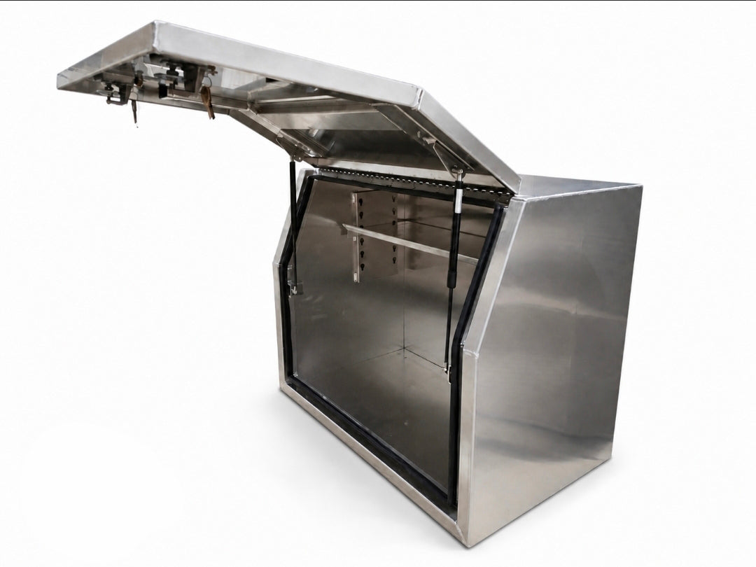 An aluminium toolbox for ute storage cabinet with its hinged lid open, showing an interior shelving, photographed on a white background.