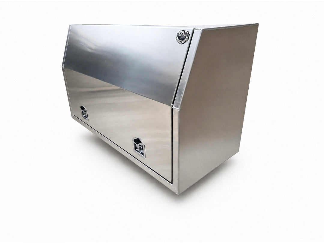 An aluminium utility storage box with a hinged top lid and a front door, shown at an angle on a white background.