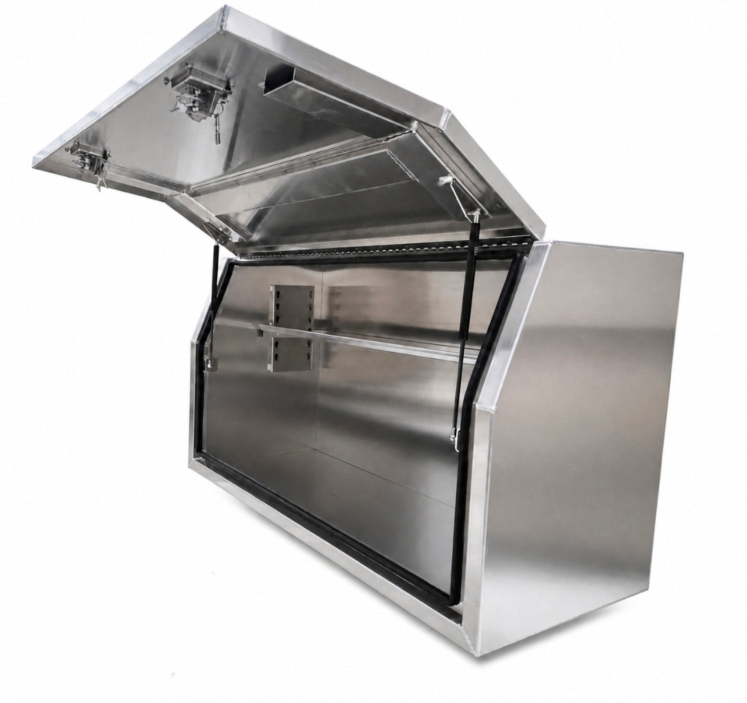 An aluminium outdoor storage box with its hinged lid open, interior shelf, photographed on a white background.