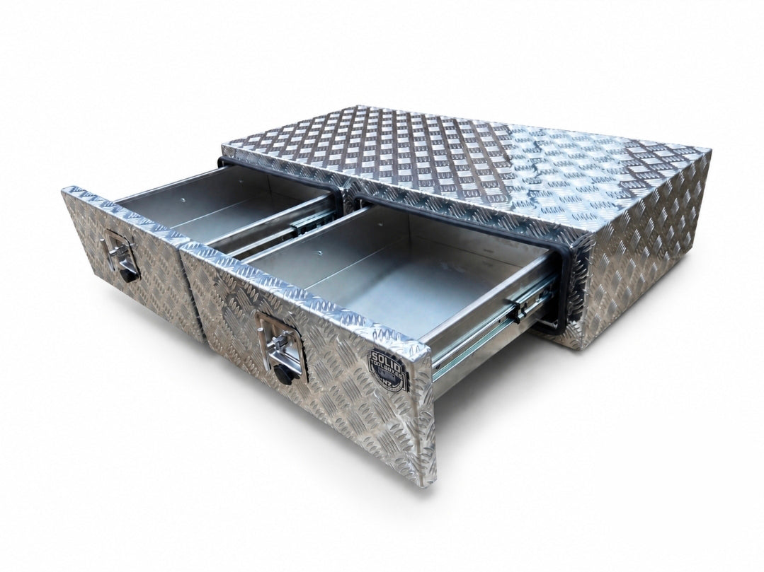 A diamond plate aluminum underbed storage box with two drawers pulled open, shown on a clean white background.
