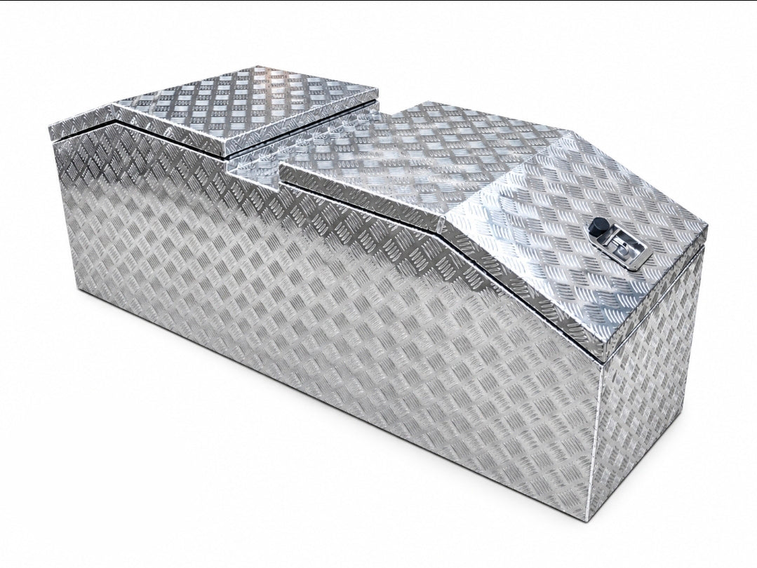A silver diamond plate aluminum storage box with a secure key lock.