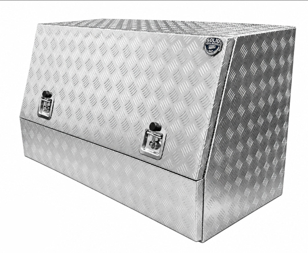 Diamond plate aluminum toolbox with a slanted top, dual key locks